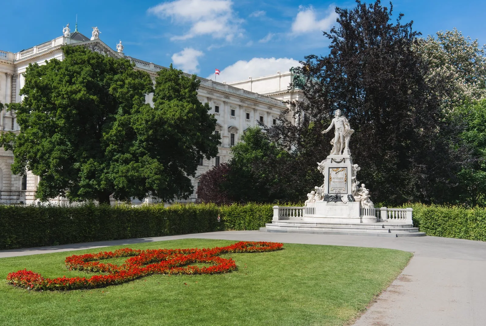 Mozart Memorial with the treble-clef flower bed in front of the Hofburg, Burggarten, Vienna