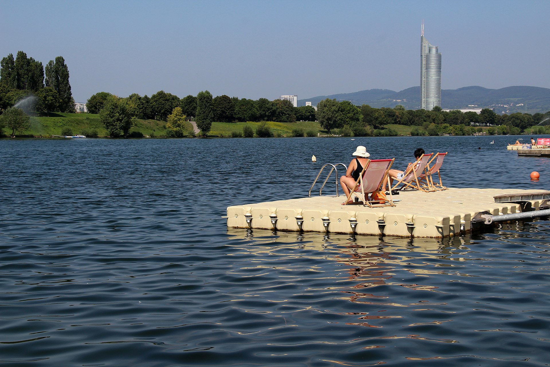 Donauinsel waterfront with DC Tower and Donau City skyline at sunset, Vienna 22nd district — photo guide by Best Alex Shots