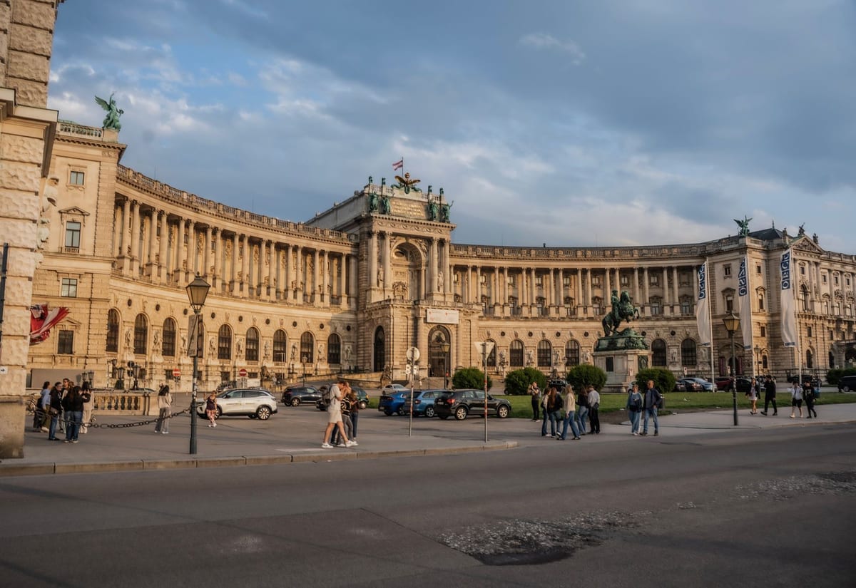 Neue Burg curved façade and Prinz Eugen equestrian statue on Heldenplatz, Vienna · evening light