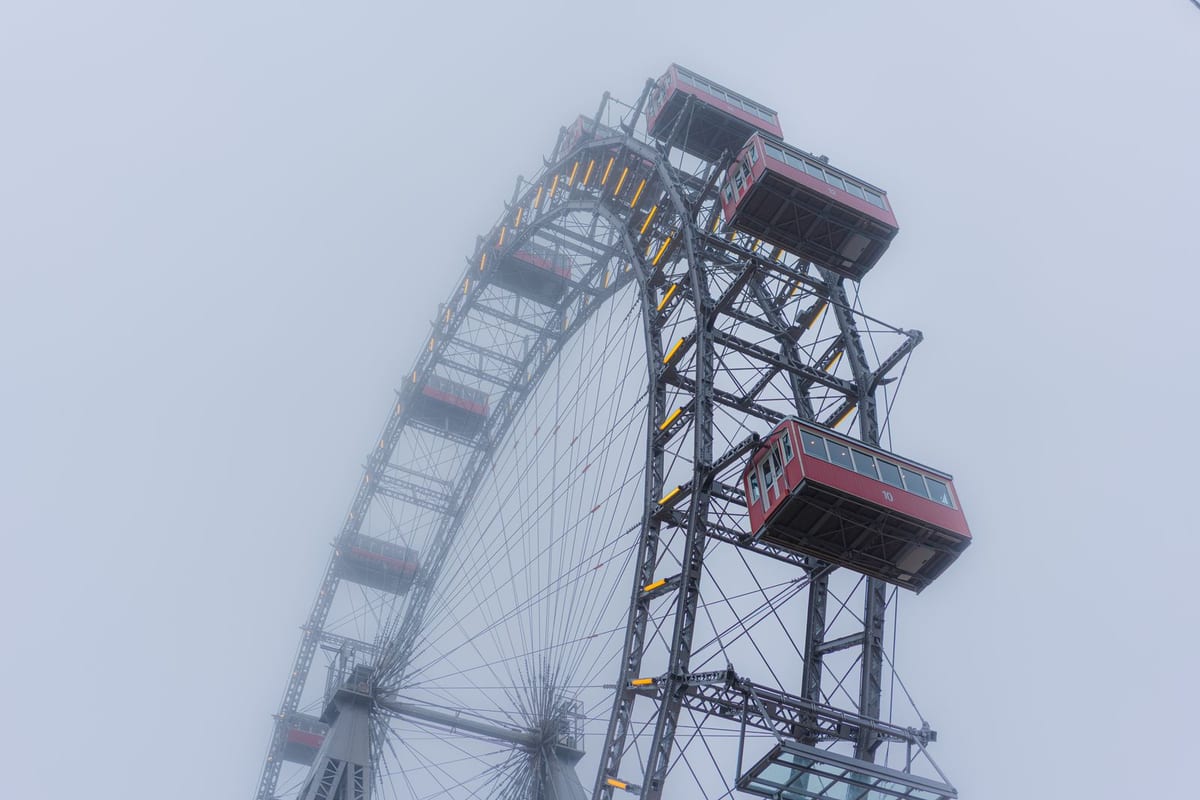 Wiener Riesenrad illuminated at blue hour with Prater chestnut trees, Vienna