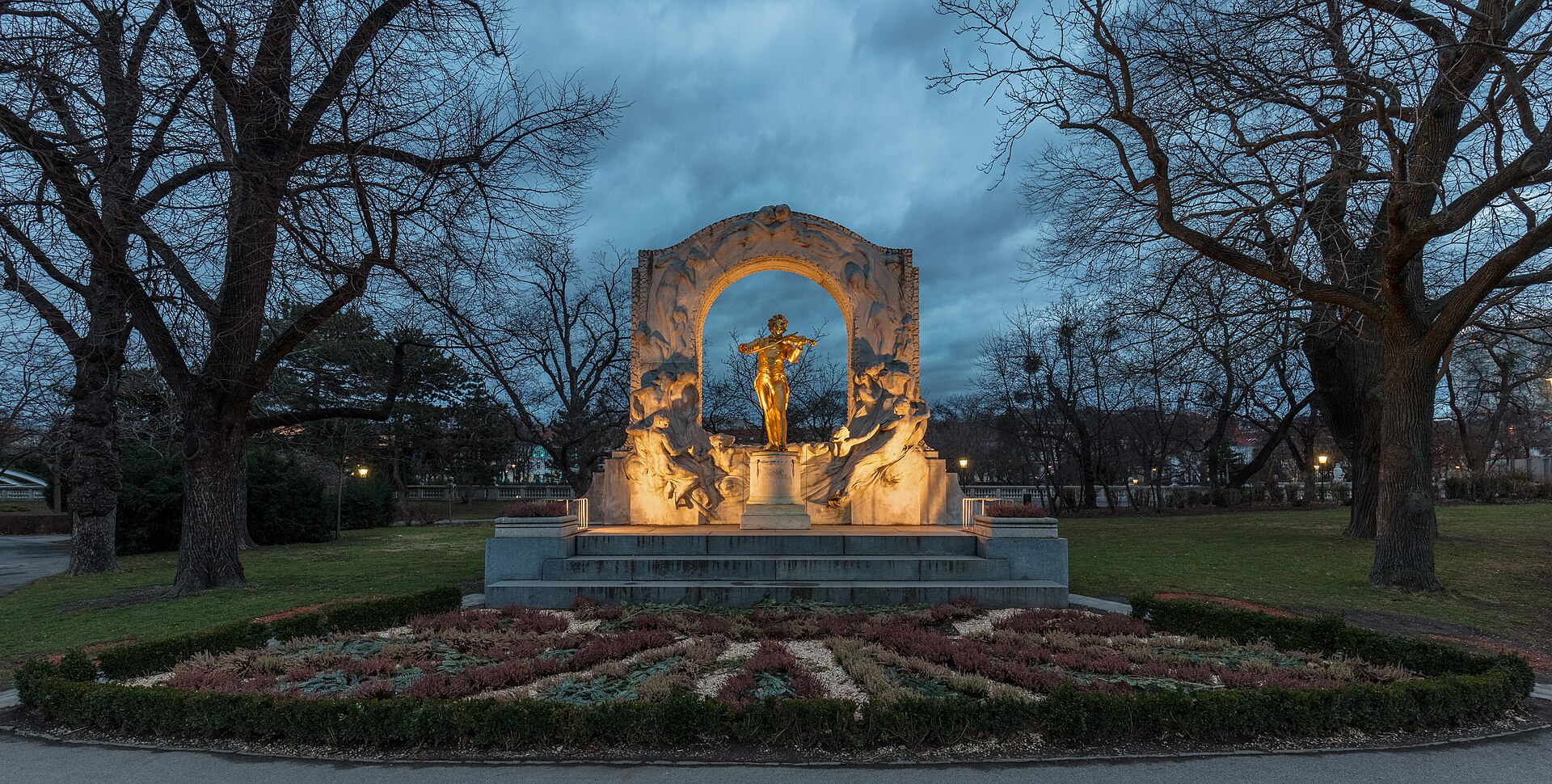 Gilded Johann Strauss memorial in Stadtpark with cherry blossom, Vienna